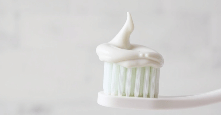 Whitening toothpaste tube and toothbrush for daily enamel safe brushing