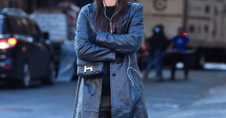 Key features of a leather trench coat with belted waist and wide lapels